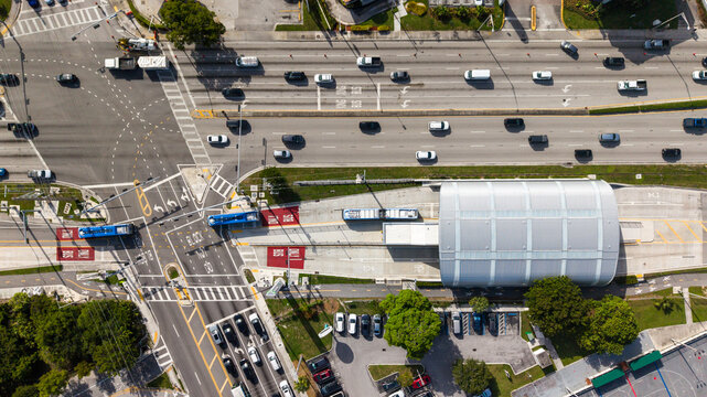 Aerial Top-Down View of Urban Transit Station with Bus Rapid Transit Lanes and City Traffic