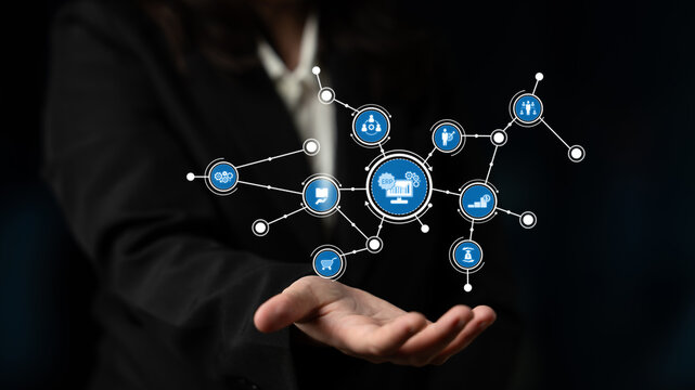 A professional hand showcasing interconnected digital icons that represent various business concepts, highlighting the integration of technology in modern strategy and communication. Tessel