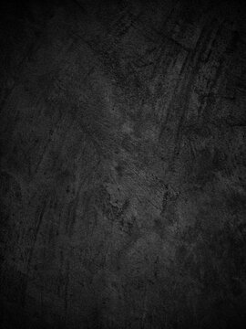 Abstract black wall background with grunge grain texture, dark distressed surface for web banners, wallpaper, templates, branding and modern graphic design with copy space