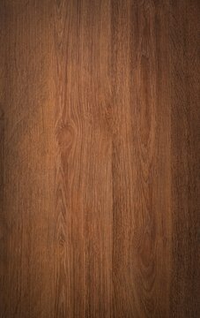 Dark wood background texture. Rustic wooden surface grain of deep brown board top view.