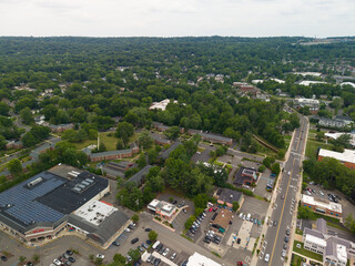 Fototapeta premium Aerial view of suburban neighborhood with green trees