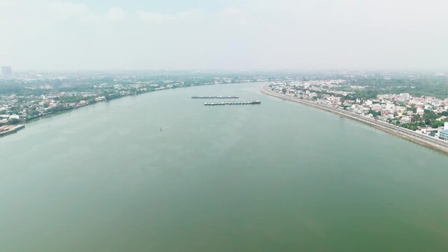 Bien Hoa City, Dong Nai, Vietnam &ndash; 4K aerial drone footage of Dong Nai River, city skyline, riverside neighborhoods, riverside houses, bridge and urban landscape