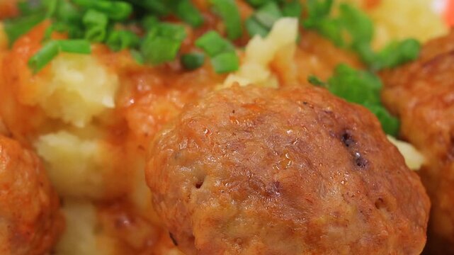 Close-up of savory meatball dish.