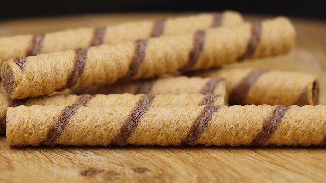 Stacked wafers on wooden surface.