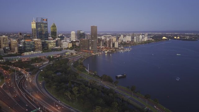 Night aerial drone view of Perth skyline and Swan River, Western Australia. 