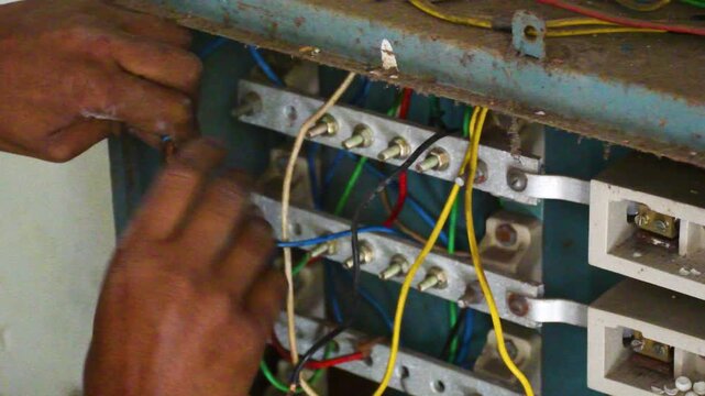 Electrician Connecting High Voltage Domestic Electrical Wires Close Up
