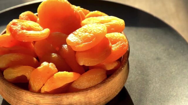 Sun-Dried Apricots in a Rustic Wooden Bowl 