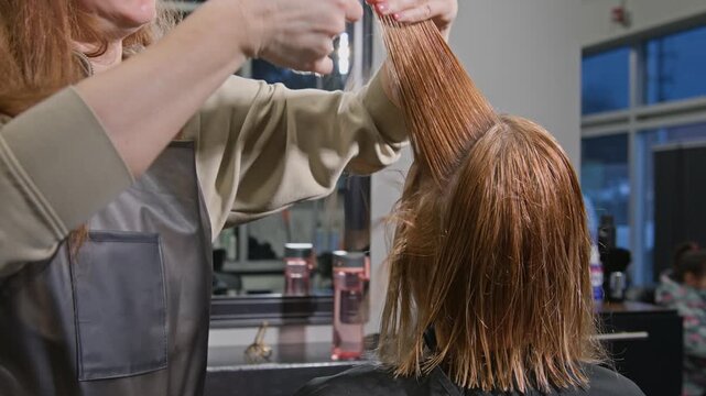 A stunning hair transformation takes place in a chic and fashionable salon, filled with natural light during the daytime