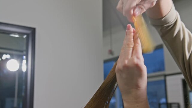 Transforming hair into a stunning new style with expert techniques and precise cuts in a chic salon setting during an afternoon session