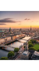 Obraz premium Aerial view of historic city at golden hour with river and bridges.
