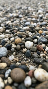 Close up of smooth pebbles on a natural beach.