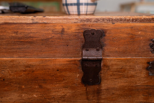 old wooded box with rusty hinge