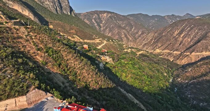 Tolantongo Mexico Aerial v3 surreal natural landscape shot drone flyover hillside secluded hot springs resort and beautiful canyon mountainscape during daytime - Shot with Mavic 3 Cine - December 2021