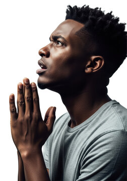 young african american man praying intensely, hands clasped, dramatic chiaroscuro lighting illuminating his desperate face against a white studio cyc wall. concept of hope and despair