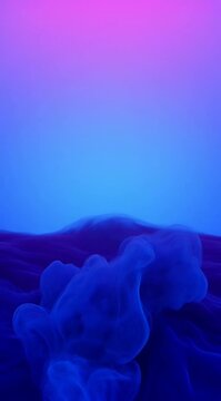 vibrant blue and purple ink clouds swirling in liquid, mesmerizing fluid motion for motion graphics or background texture