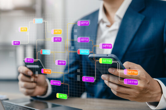 Businessman using smartphone with connected workflow sets.