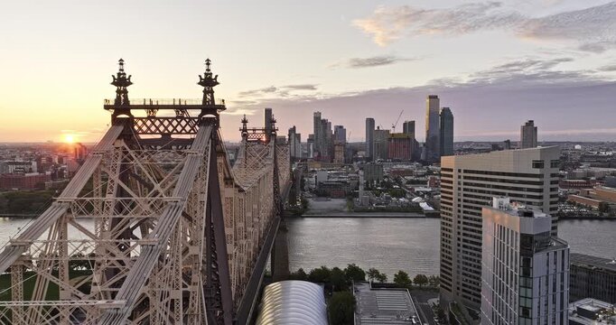 NYC New York Aerial v364 drone fly along Queensboro bridge over East river capturing commuting traffic and sunrise cityscape of Long Island City at Queens - Shot with Mavic 3 Pro Cine - September 2023