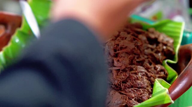 Gudeg is a specialty dish from Yogyakarta (Indonesia) made from young jackfruit cooked with coconut milk and teak leaves to give it a black color.