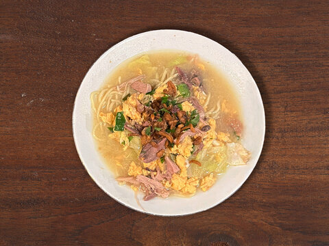 Bakmi Godok Java, Delicious Indonesian Noodle Soup Served Hot with Shredded Chicken, Cabbage, and Boiled Egg