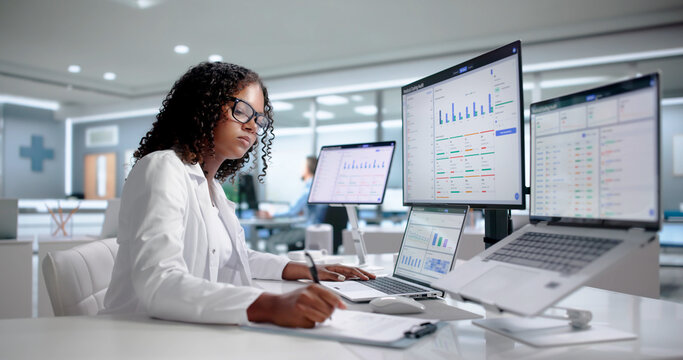 Medical Coder Woman Analyzes Billing Claims Using Laptop