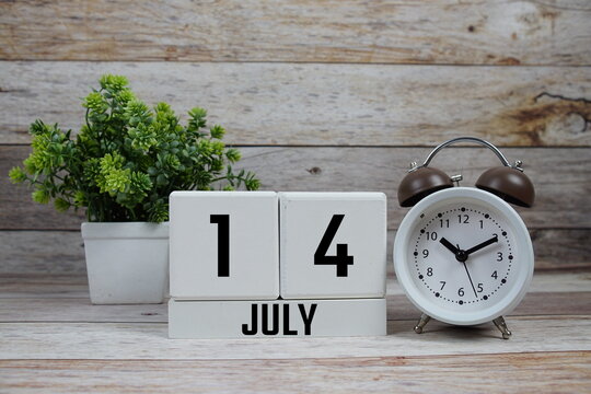 Wooden Calendar Showing the Date of July 14th. Day 14 of July month