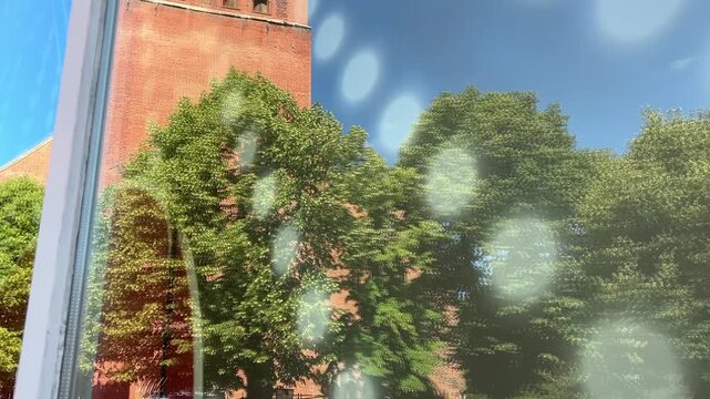 L&uuml;neburg St. Johannis Church tower reflection in window, Germany