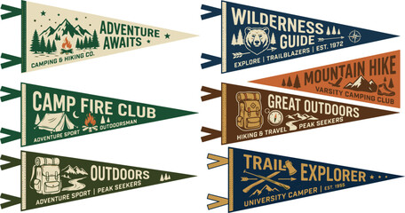 Fototapeta premium Set of retro-style outdoor flags featuring hiking, wilderness, and mountain motifs for classic camping branding.