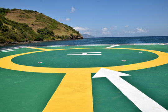 A helipad on the shore of Gili Mori, Labuan Bajo, East Nusa Tenggara, Indonesia, with bright colors and the letter H symbol