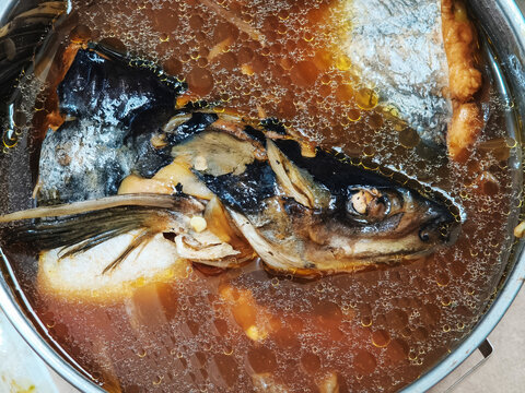 Pindang Patin Fish Head Soup Recipe, Rich Indonesian Broth. Aromatic Indonesian patin fish head soup. Savor the rich, glistening herbal broth packed with traditional spices and tender, river fish.
