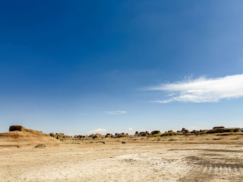 Majestic Yardang landform of Urho Ghost City under a dramatic cloudy sky in Karamay, Xinjiang, China. 
