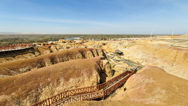 Unique colorful Yardang landform of the Five Color Beach along the Irtysh River under a blue sky, Xinjiang.