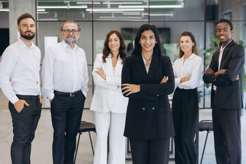 Confident business professionals standing together, diverse executive team inspiring teamwork and...