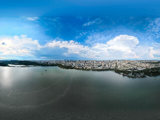 Fototapeta premium Aerial shot of Hangzhou city, West Lake and surrounding mountains framed under white clouds