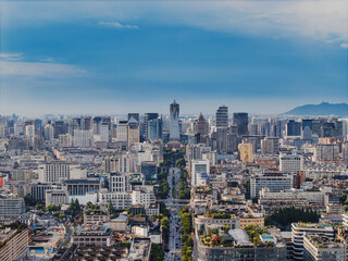 Obraz premium Aerial shot of Hangzhou city, West Lake and surrounding mountains framed under white clouds