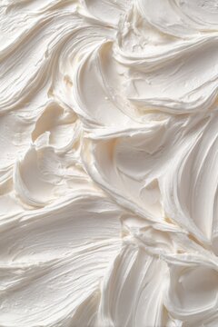 Creamy white frosting texture swirls background with frosting background abstract close-up culinary buttercream delicious ingredient movement decoration confectionery