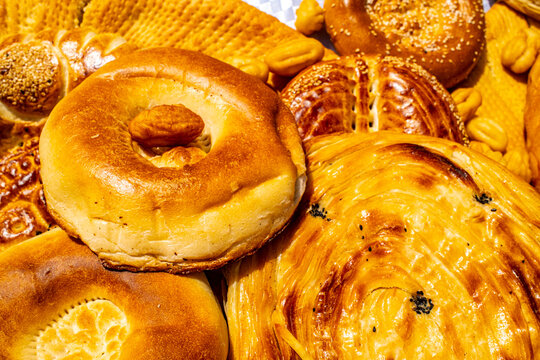 Close up of traditional Central Asian round flatbread with spiral pattern at Tajik market stall