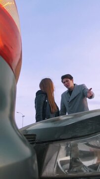 Young woman shouting at man after a car accident