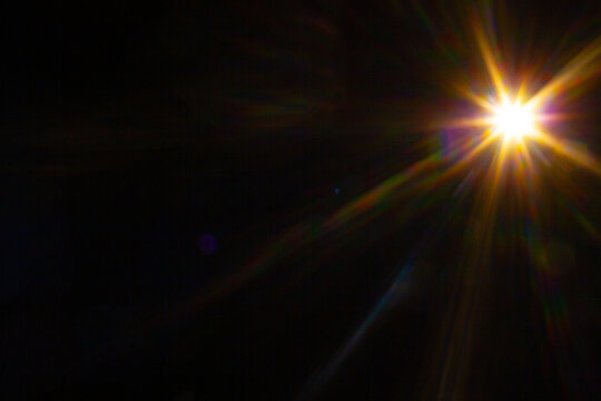 Sun flare on the black background