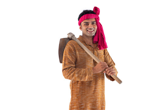 Portrait of happy farmer with spade on shoulder