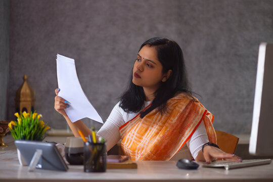 Woman working on desktopcomputer at office