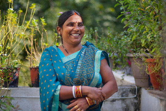 portrait of a smiling  indian house maid 