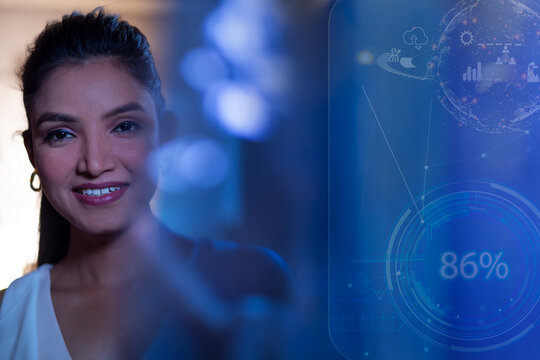 Businesswoman Smiling with icons on virtual screen