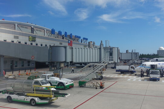 Ground handling vehicles and jet bridge at Penghu Airport.