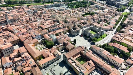 Fototapeta premium High altitude aerial shot of Prato urban area and horizon.