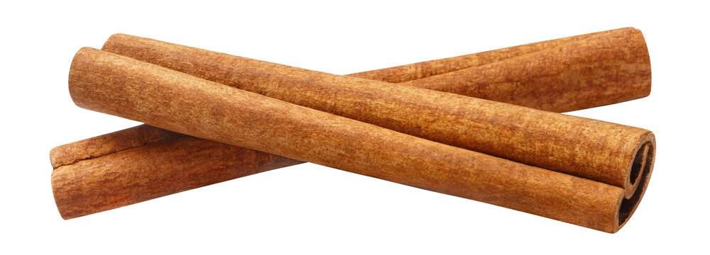 Two cinnamon sticks with rolled bark, isolated on transparent cutout background