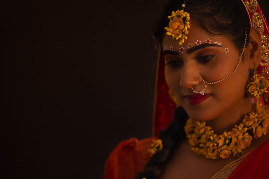 Close-up portrait of young woman dressed up as Lord Radha on the occasion of Janmashtami