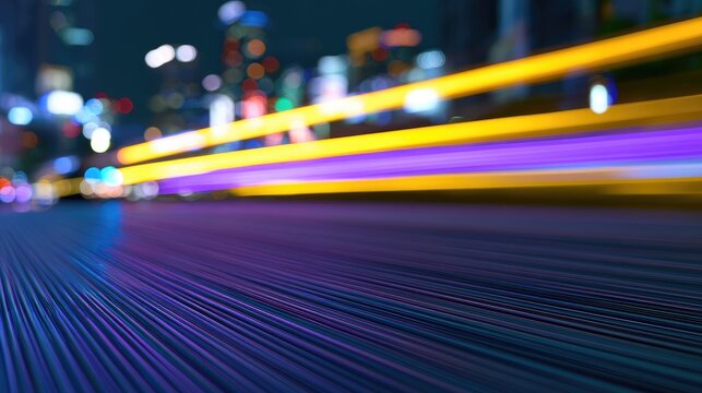 Abstract streaks of light blur across a city street at night