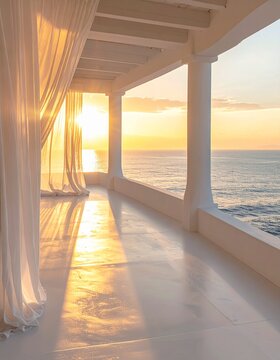 White seaside balcony with sheer curtains flowing in the breeze at golden sunset over the ocean