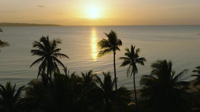 Drone view of tropical beach with sunset background. Santa Fe, Tablas, Romblon. Philippines.
