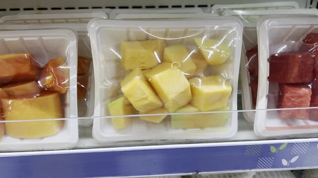 Fresh Cut Cantaloupe Melon Slices Packed in Plastic Wrapped Tray